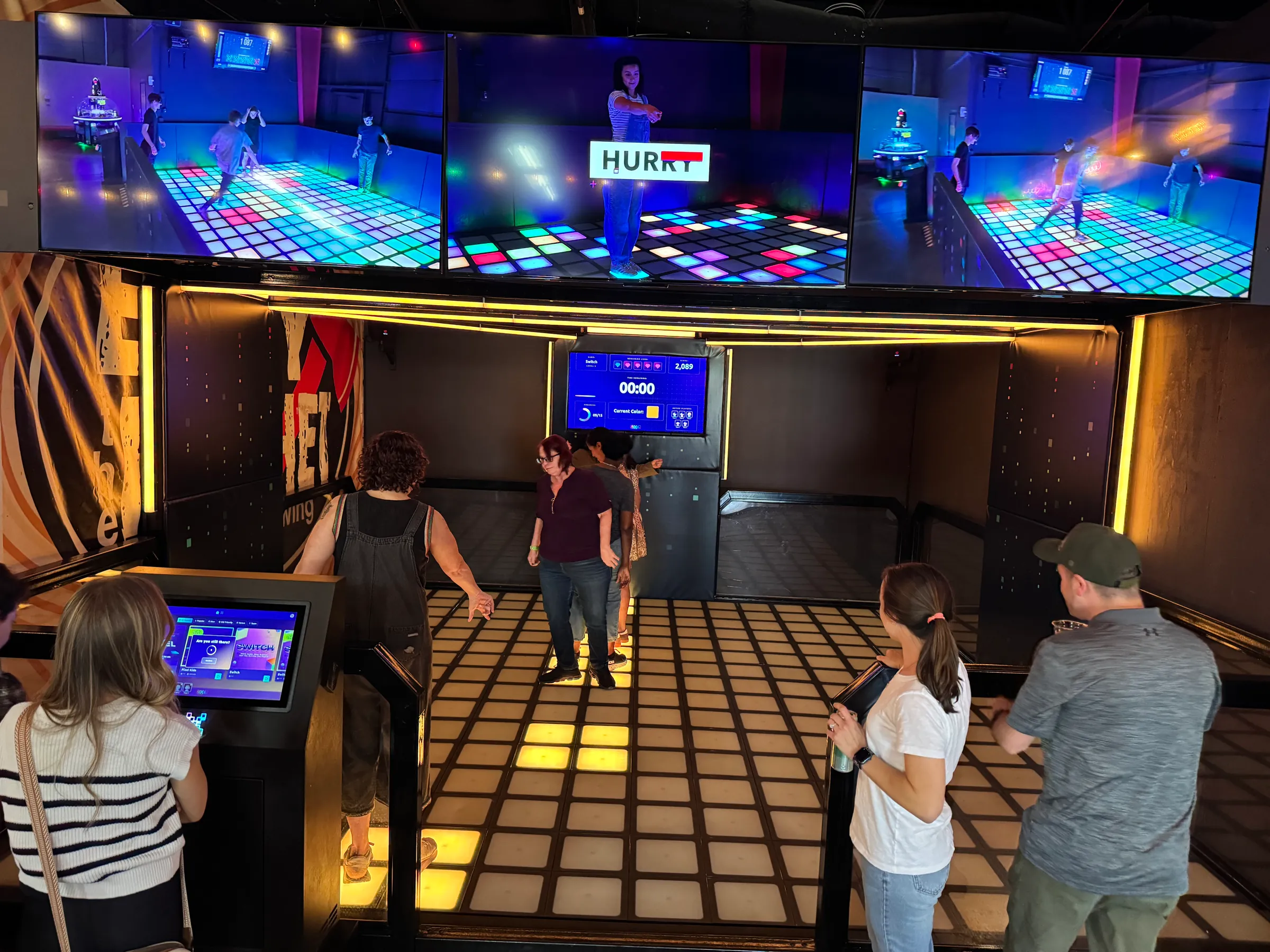 Kids playing on the Pixel Game Floor at Electric Sports Social