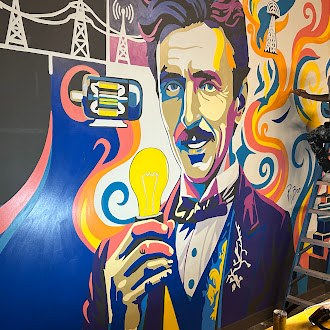 Tesla-themed mural inside Electric Sports Social