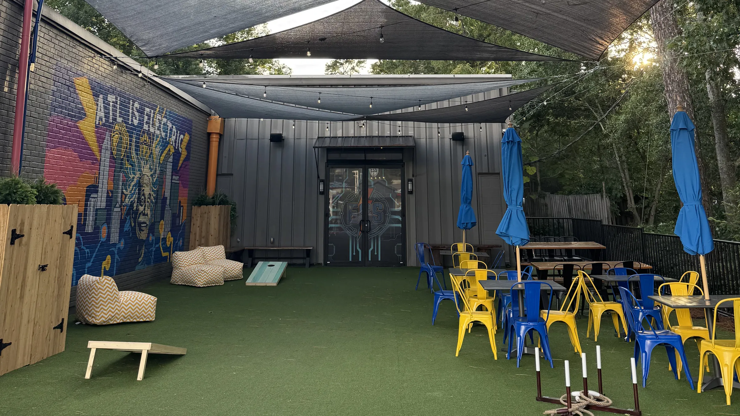 Electric Sports Social storefront in Sandy Springs at dusk